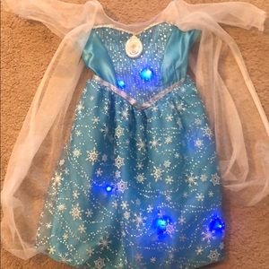 Elsa Light up and “let it go” singing dress. 4-6X